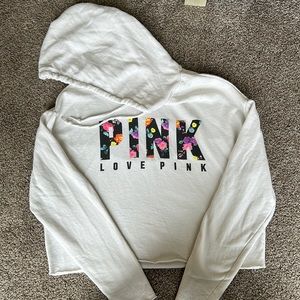 PINK crop hoodie with open back.